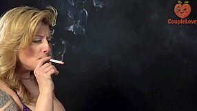 wanna watch this milf smoke while worshipping my huge cock with her big natural tits?