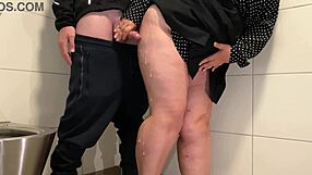 Hey juicy milf pulls out cock for wank in public toilet stall