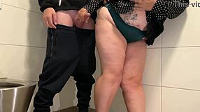 Hey juicy milf pulls out cock for wank in public toilet stall