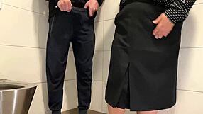 Hey juicy milf pulls out cock for wank in public toilet stall