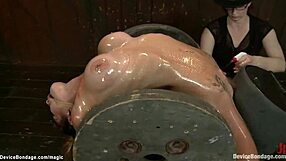 Busty Dyke Endures Whipping Agony in Extreme Bondage Torment