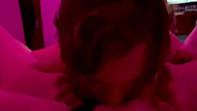 real couple shares a tender intimate moment under red lights