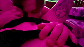 real couple shares a tender intimate moment under red lights