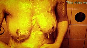 Slow motion shower drips over sexy wet tits and perky nipples