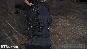 in the garage the restrained girl faces her punishment step by step