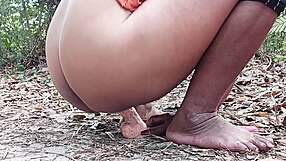 Wow, watch this pretty girl tease her wet pussy with a huge dildo in the forest till she squirts!
