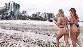 check out this slutty milf flashing pussy and ass on beach with her hot friend trailer