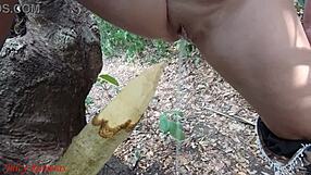 Perverted slut squirts piss from wooden stake in forest
