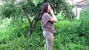 outdoor milf in tight jeans soaks her shaved mature pussy with golden shower in public garden