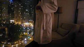 petite wife touches herself by the hotel window