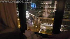 petite wife touches herself by the hotel window