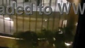 petite wife touches herself by the hotel window
