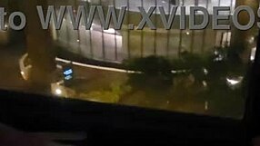 petite wife touches herself by the hotel window