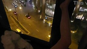 petite wife touches herself by the hotel window
