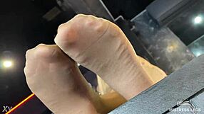 beautiful feet of the mistress in flesh-colored tights tease you