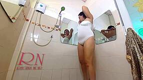 classy lady oils her legs and shaves pussy in mirror