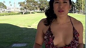 Mia li shows off her bushy pussy in some upskirt action outside