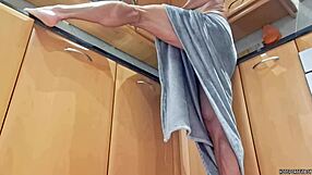 Hidden camera catches muscular housekeeper in kitchen