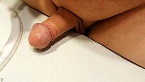 Chubby guy washes his cock outside