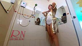 classy lady oils her legs and shaves pussy in mirror