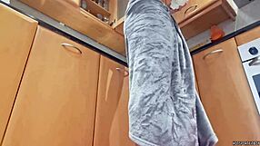 Hidden camera catches muscular housekeeper in kitchen