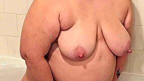 Milf gets pissed on big preggo tits