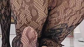 teasing in sheer fishnet bodysuit for worship