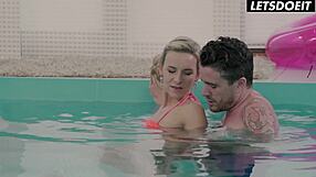 Tattooed stud fucks bikini blonde at pool edge