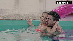 Tattooed stud fucks bikini blonde at pool edge