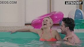 Tattooed stud fucks bikini blonde at pool edge