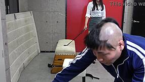 japanese female teacher gives a masochistic man a facesitting and handjob in the gym storage closet